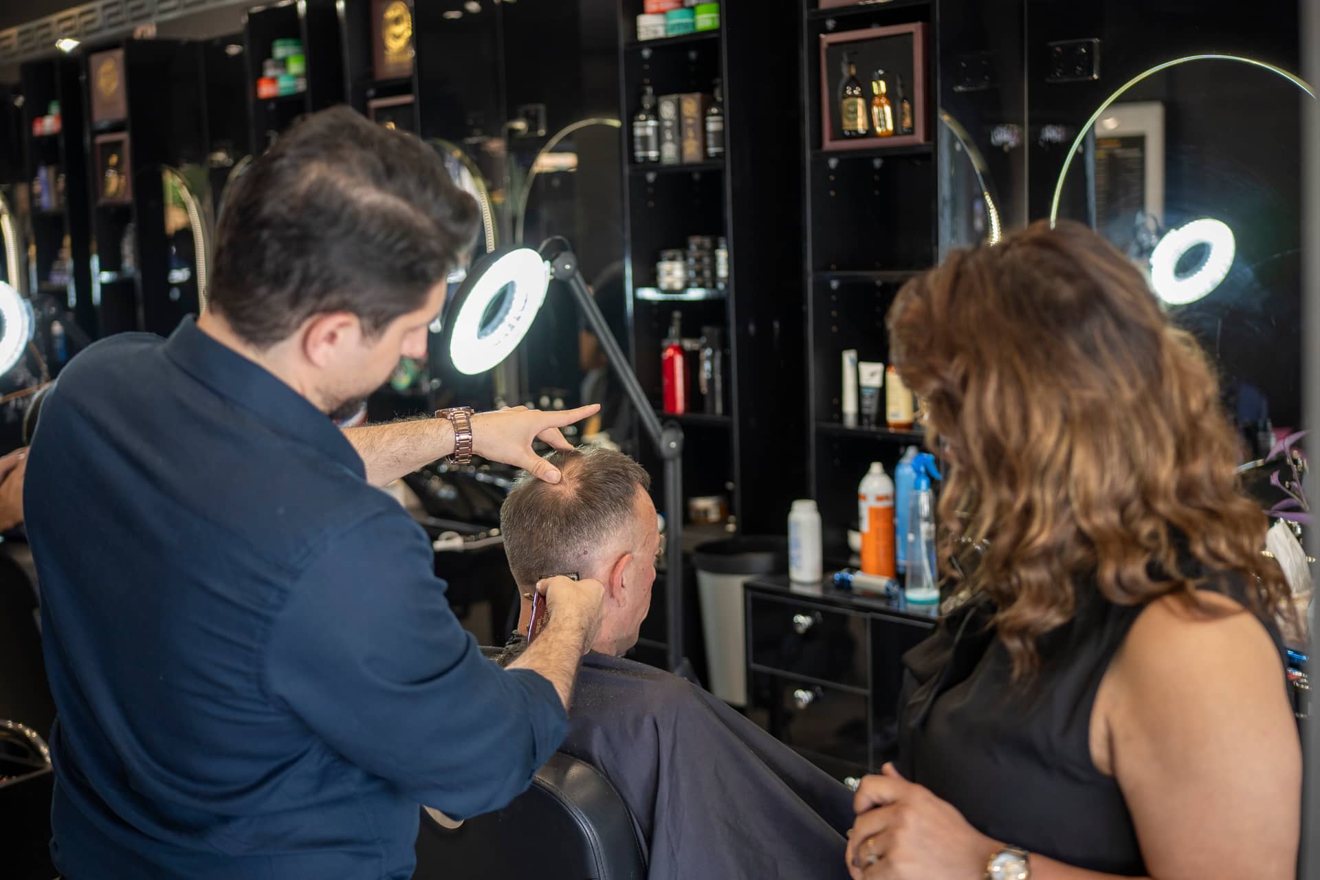 Harry.M performing a precision haircut in his home studio