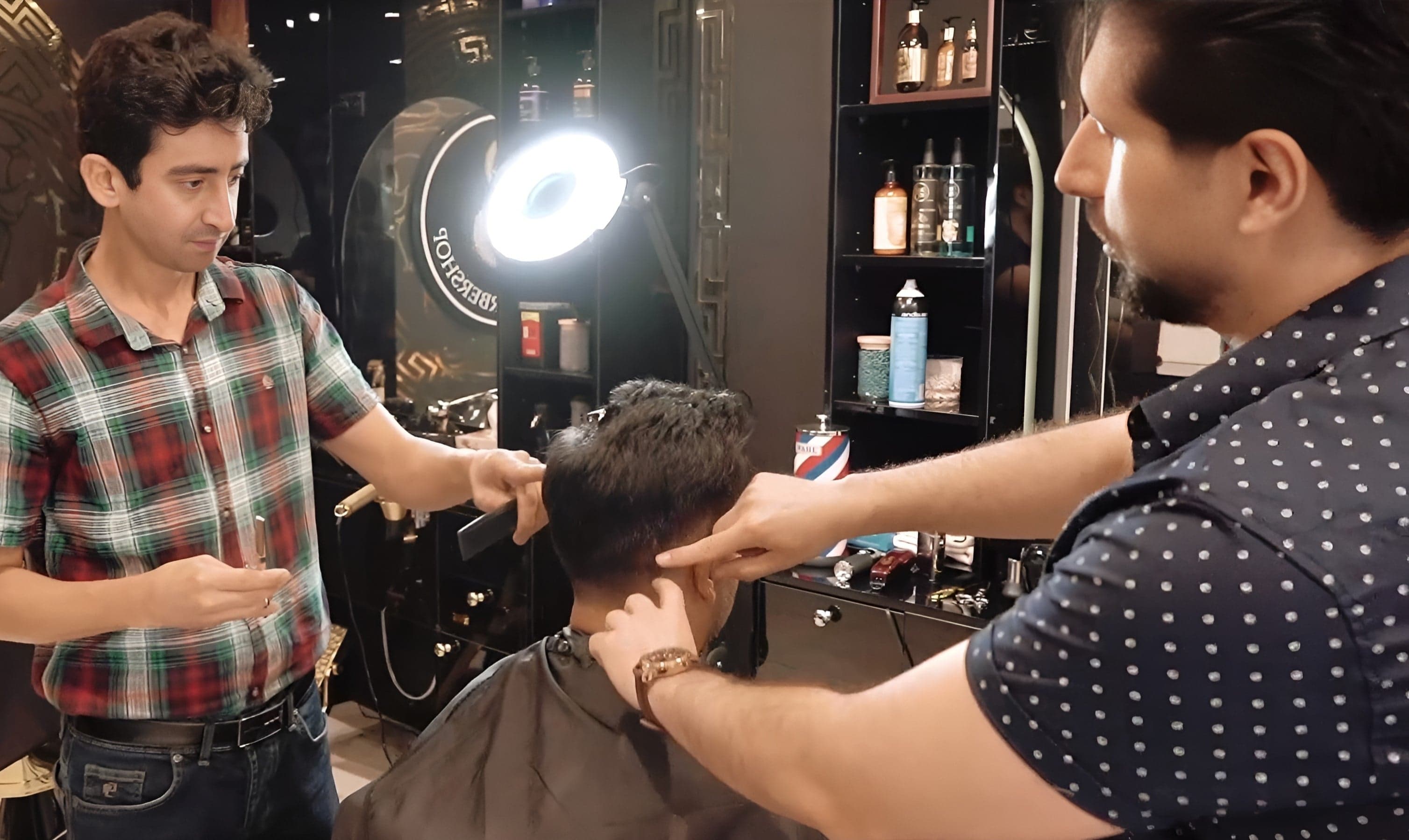 Group of barbering students at Harry.M Academy