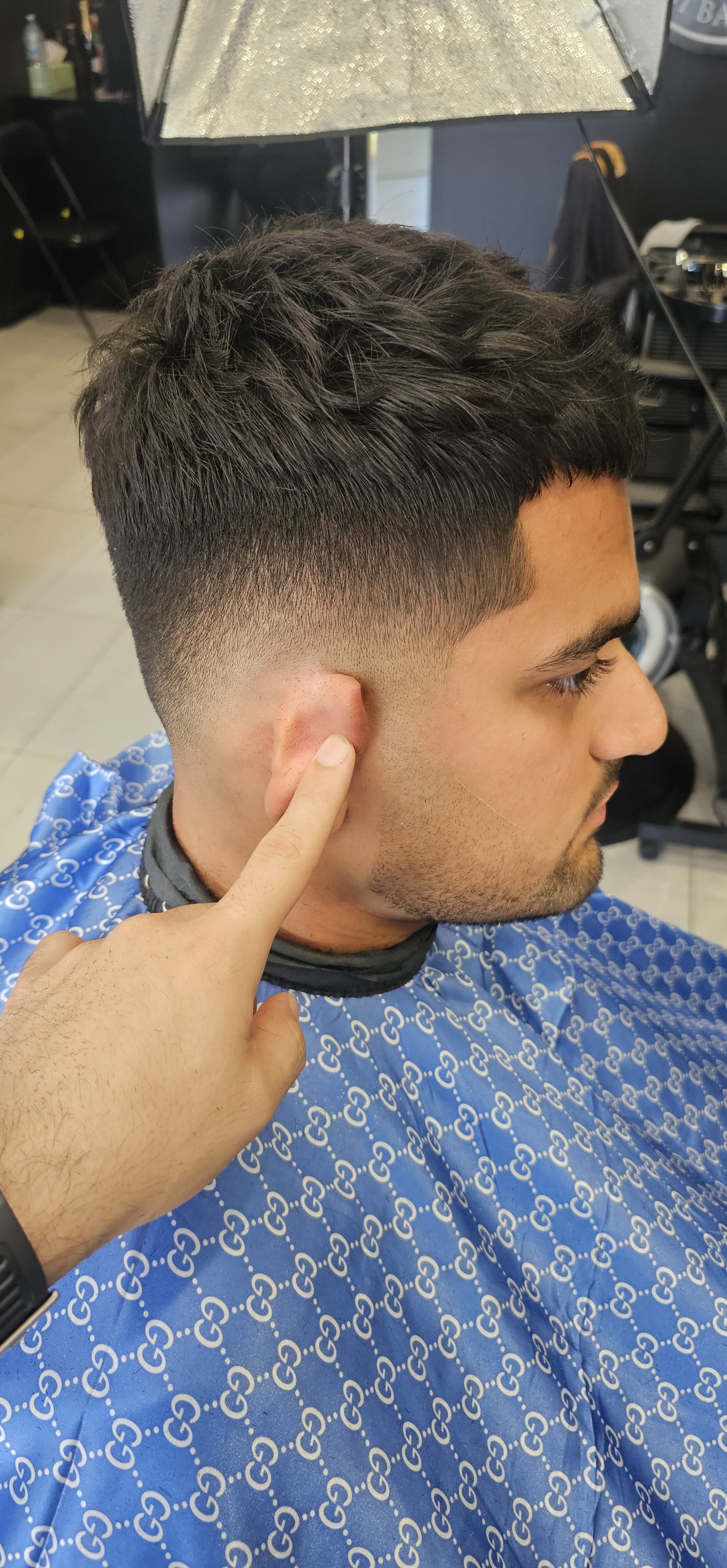 Student practising a precision cut during Harry.M barbering class