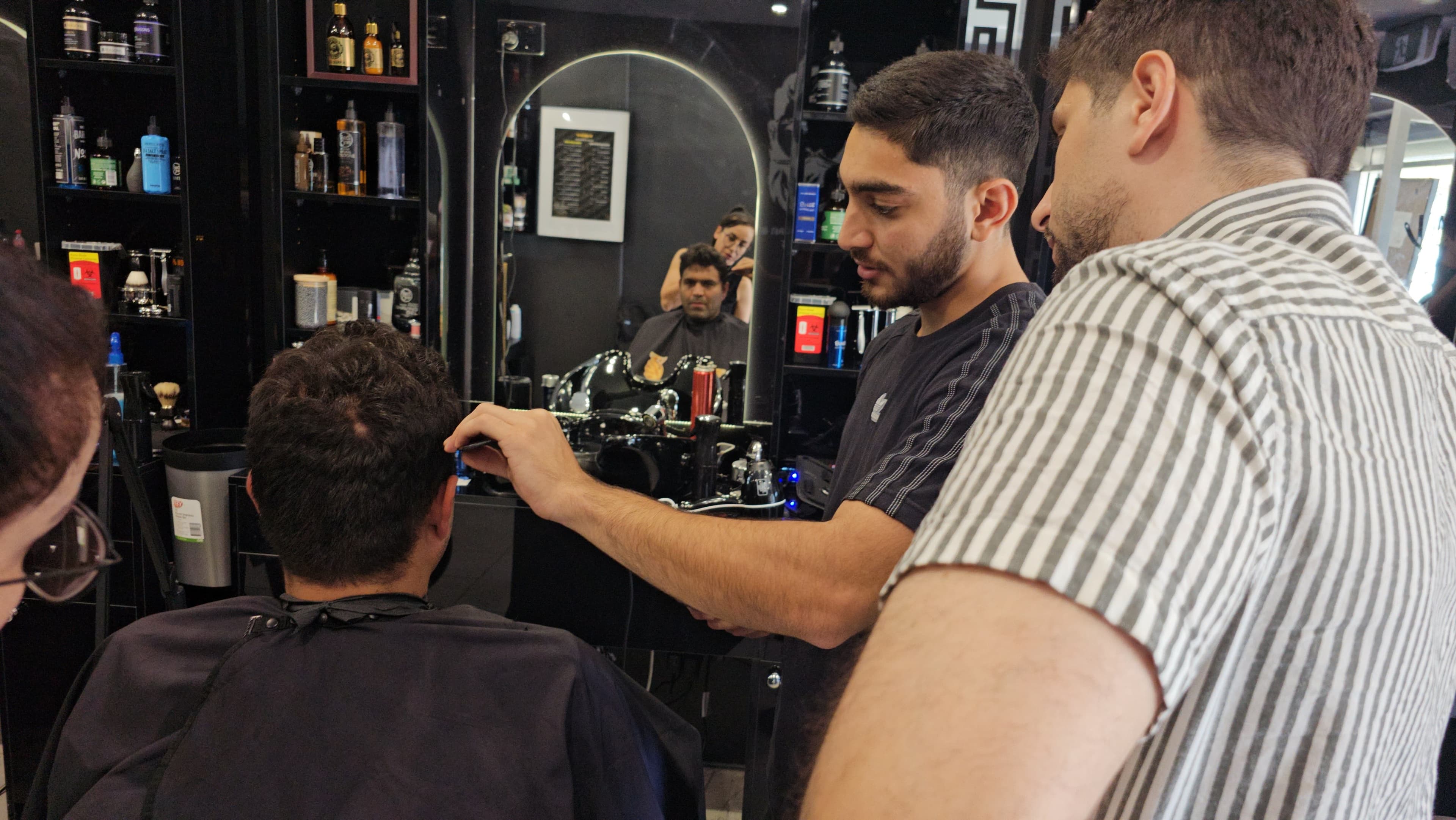 Professional barbering tools laid out at Harry.M Academy