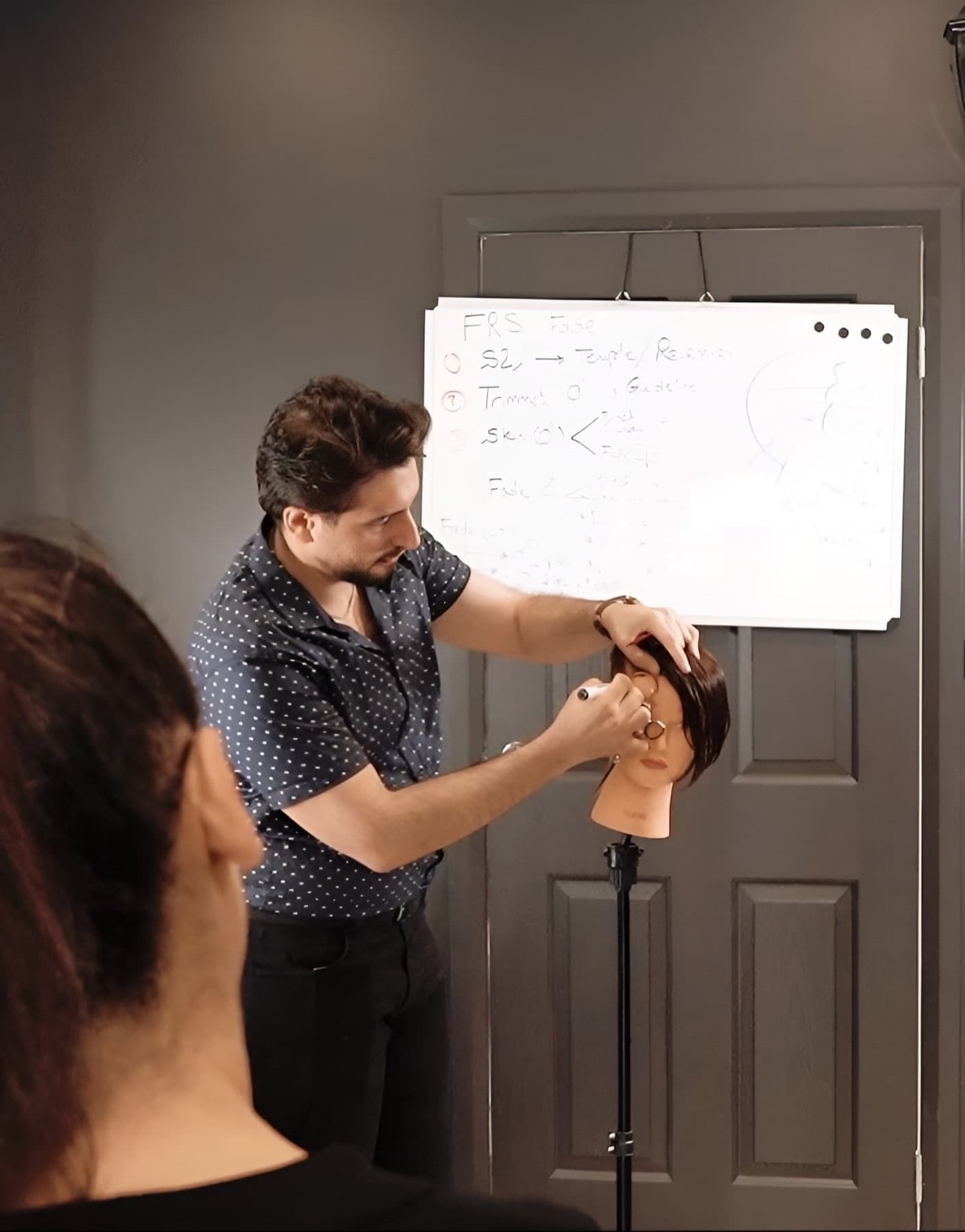 Harry.M – Professional barbering instructor teaching a class in Sydney