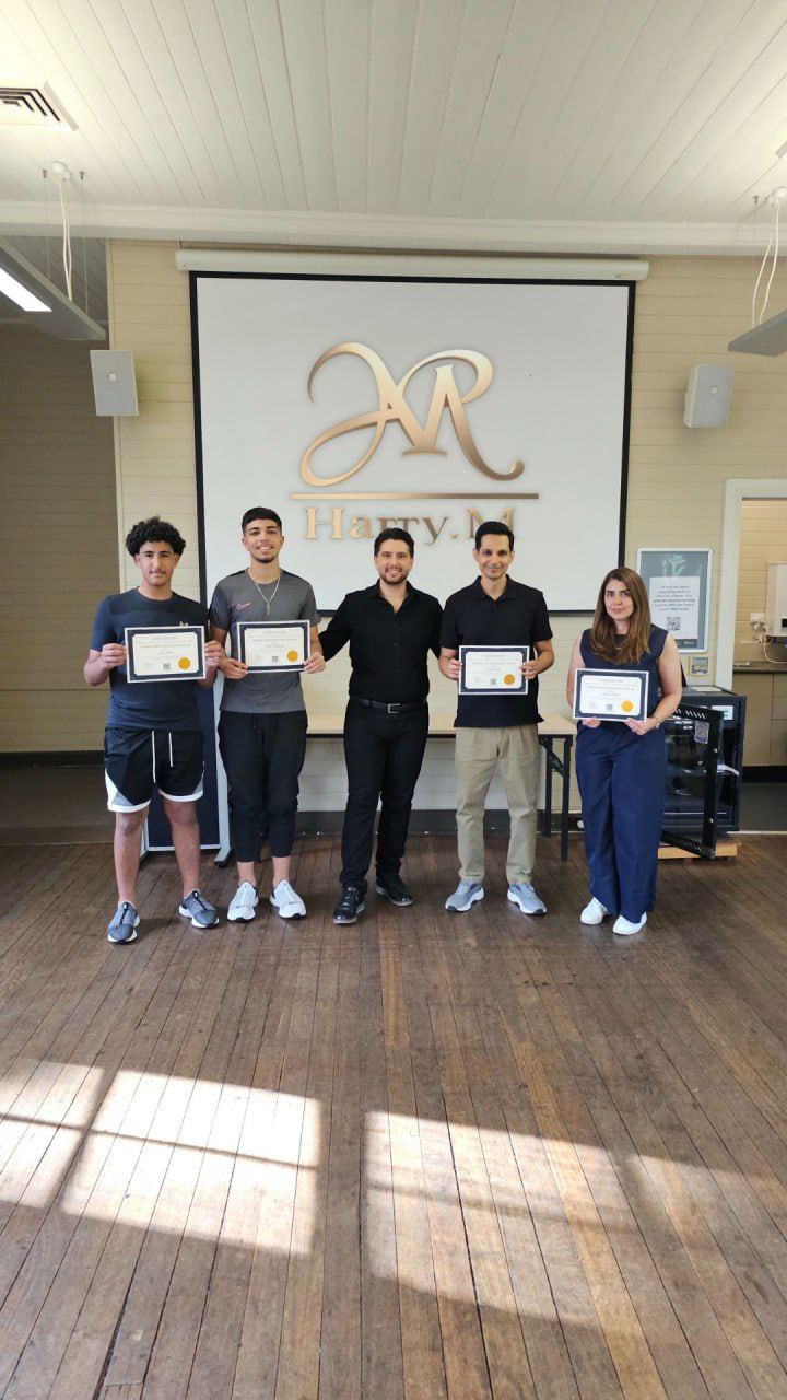 Harry.M providing one-on-one feedback to a student during a practical session