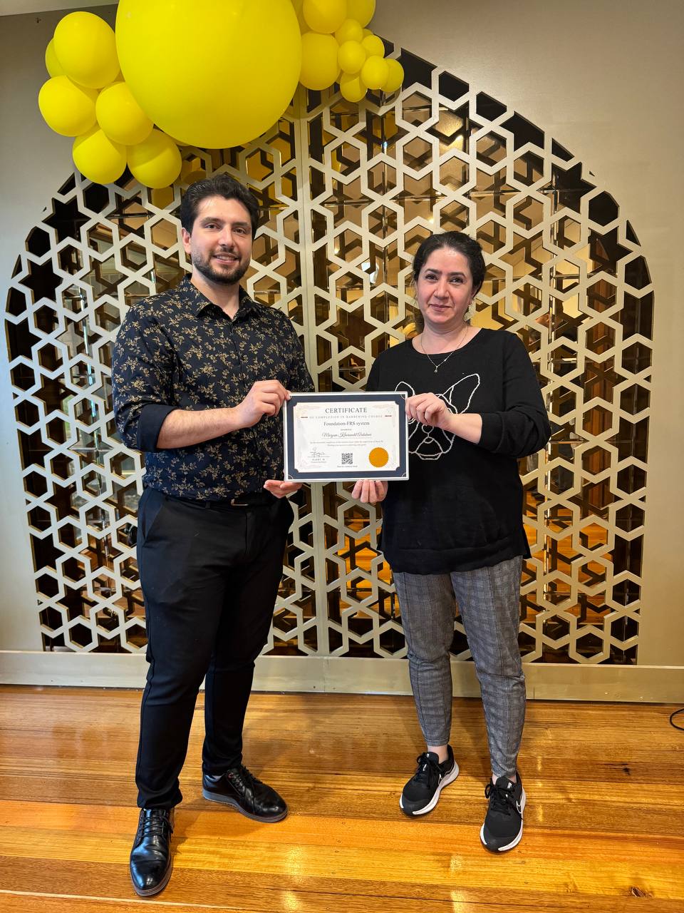 Harry.M providing one-on-one feedback to a student during a practical session