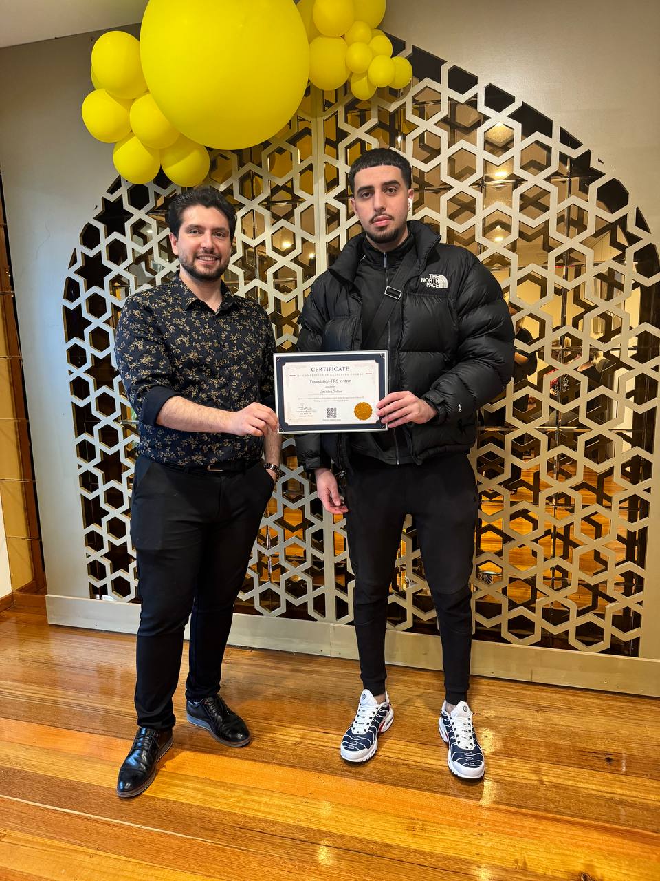 Harry.M providing one-on-one feedback to a student during a practical session