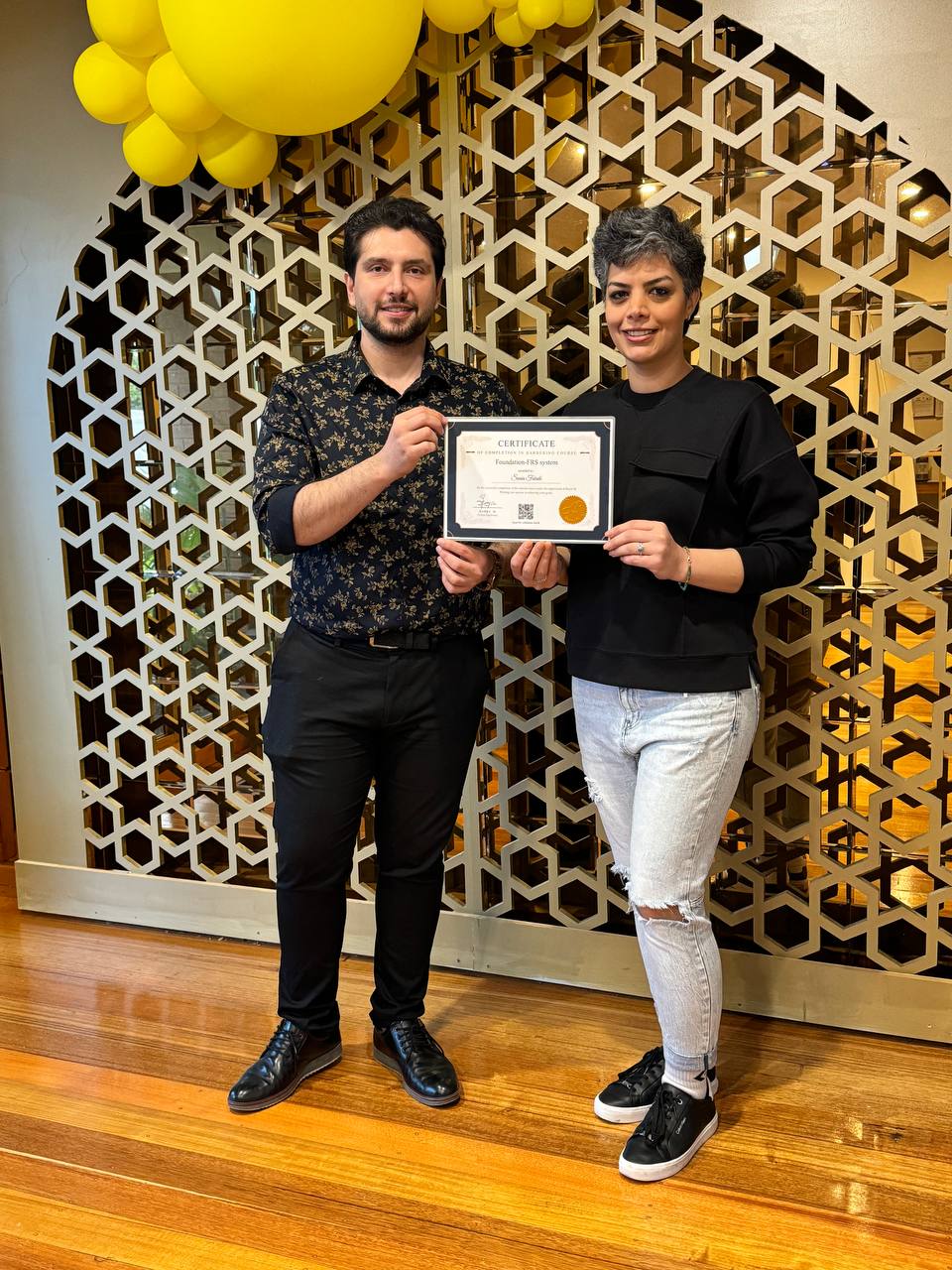 Harry.M providing one-on-one feedback to a student during a practical session